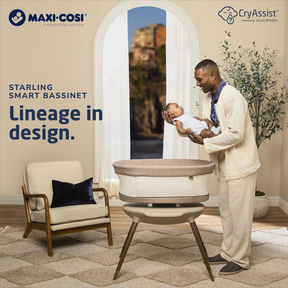Dad holds baby over Maxi-Cosi Starling Smart Bassinet - Natural Heritage