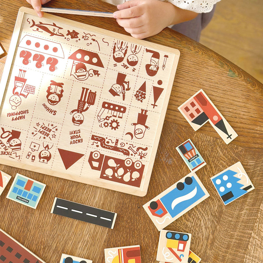 Little girl plays with Mentari Toys Town Puzzle
