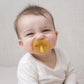Baby using Natursutten Natural Rubber Butterfly Pacifier - Rounded