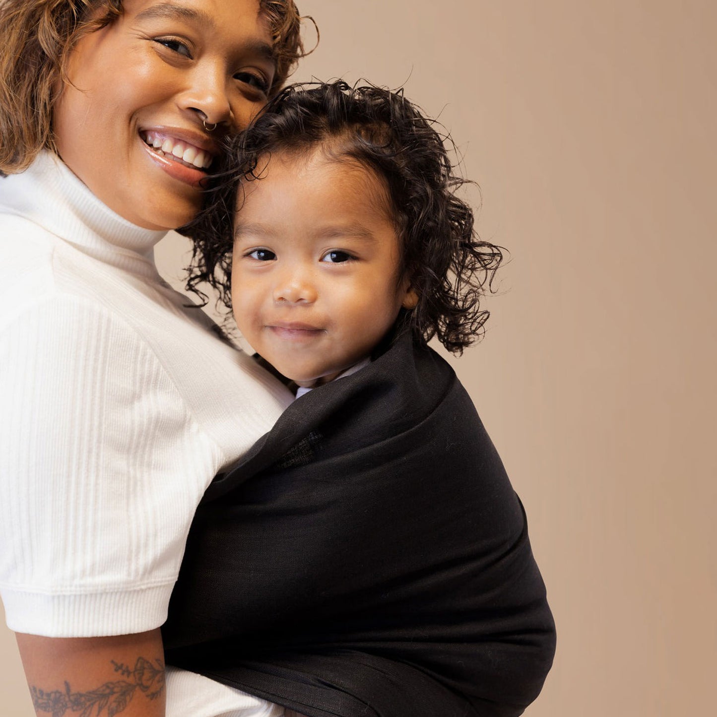 Mom wearing toddler in WildBird Linen Sling - Raven