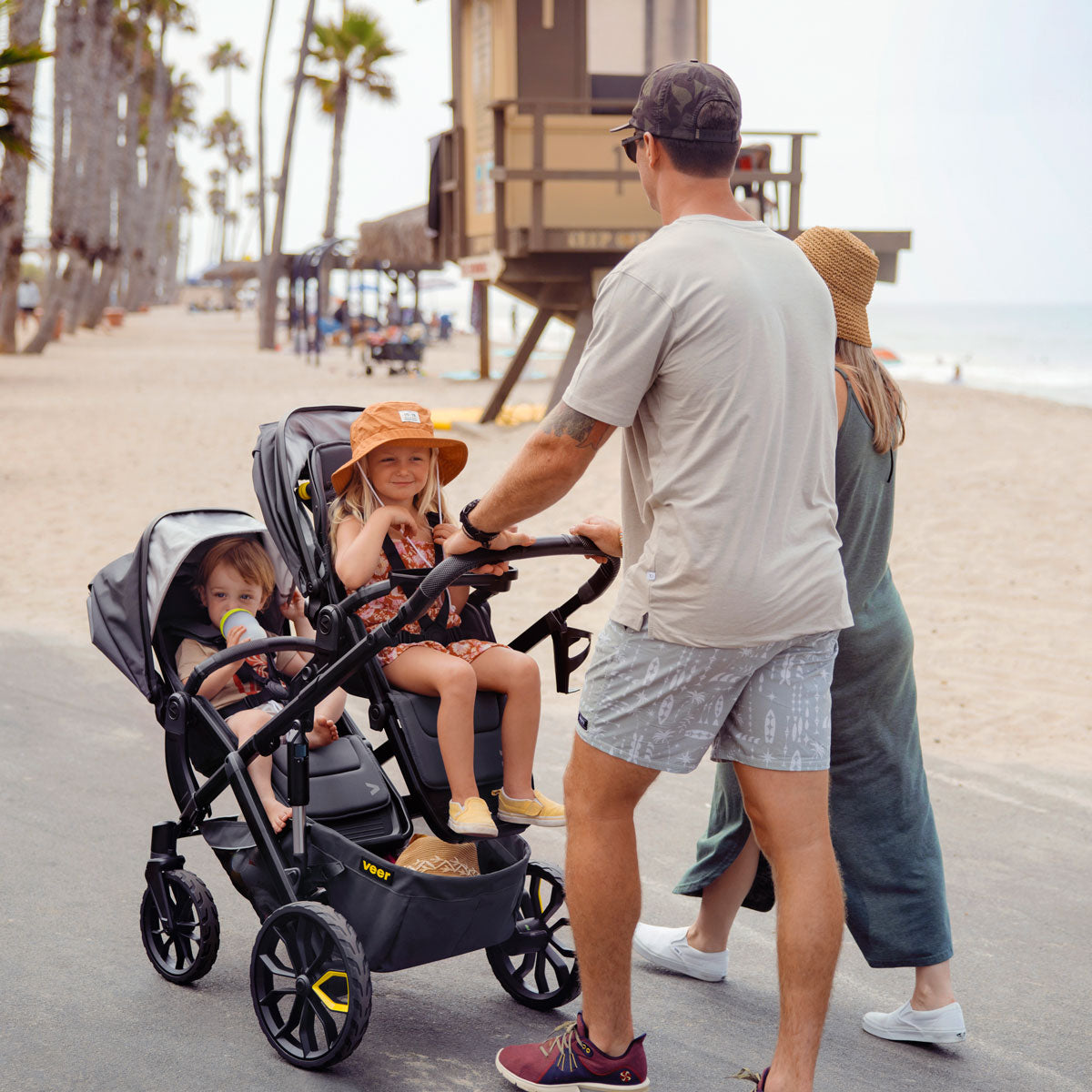 Children riding in Veer Switch&Roll Luxe Bundle - &Roll Stroller Frame / Switchback Seat Luxe - Gray Granite