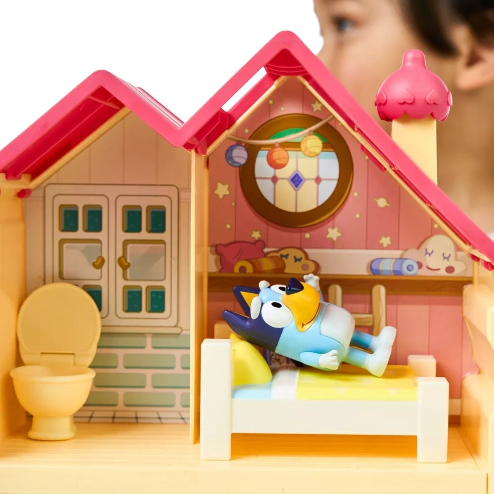 Child playing with Moose Toys Bluey Mini Home Playset