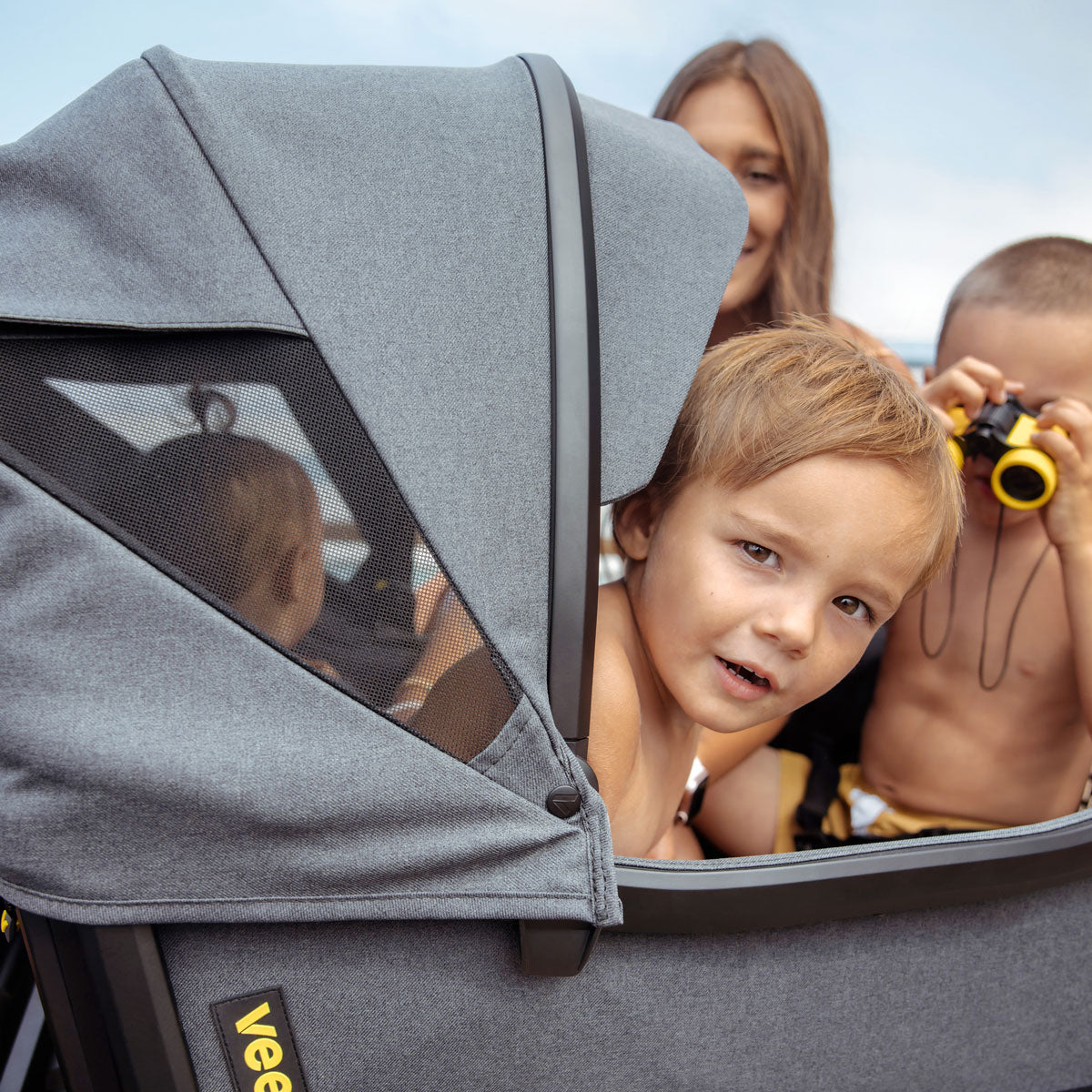 Children in Veer Cruiser with Veer Cruiser XL Visor for Retractable Canopy