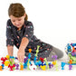 Child Playing with Fat Brain Toys Squigz Starter Set