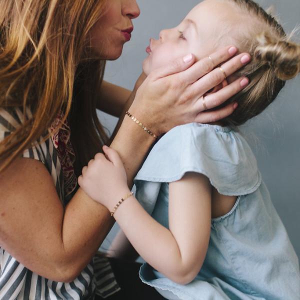 Mother Wearing Made by Mary Gold Filled Poppy Bracelet