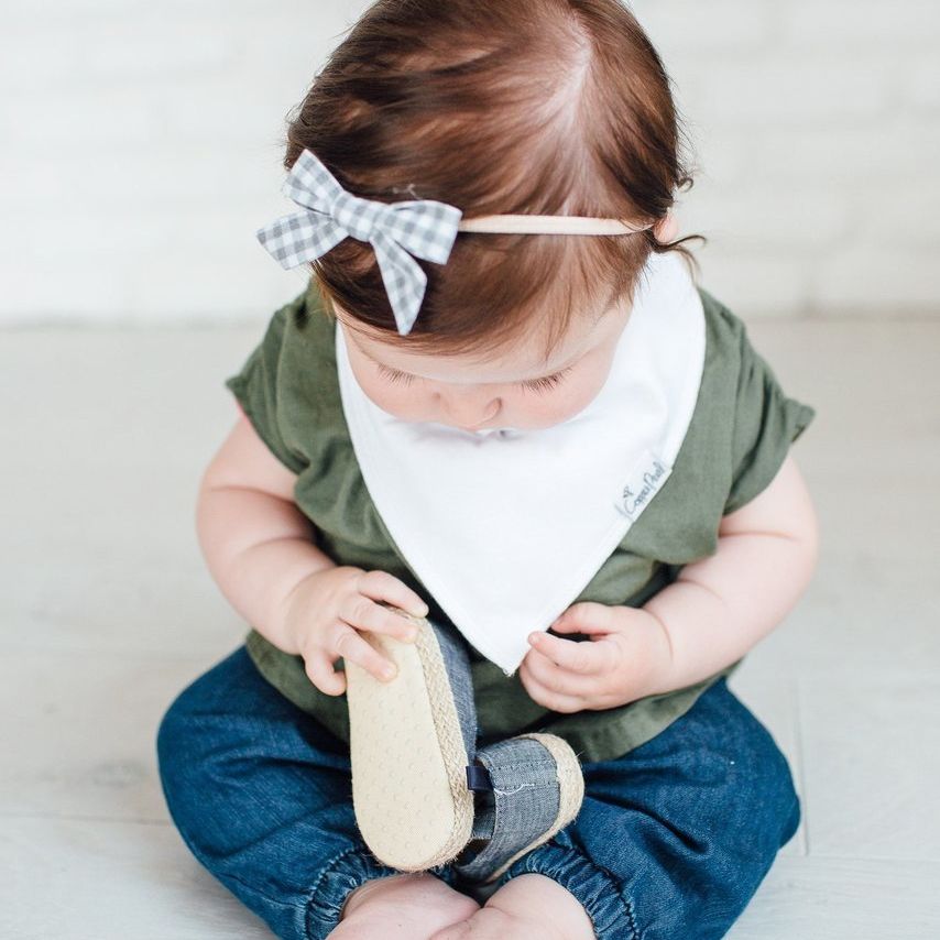 Baby wearing Copper Pearl Single Baby Bandana Bib - White