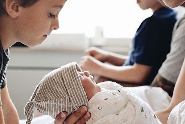 Helping Older Siblings Adjust To New Baby's Milestones