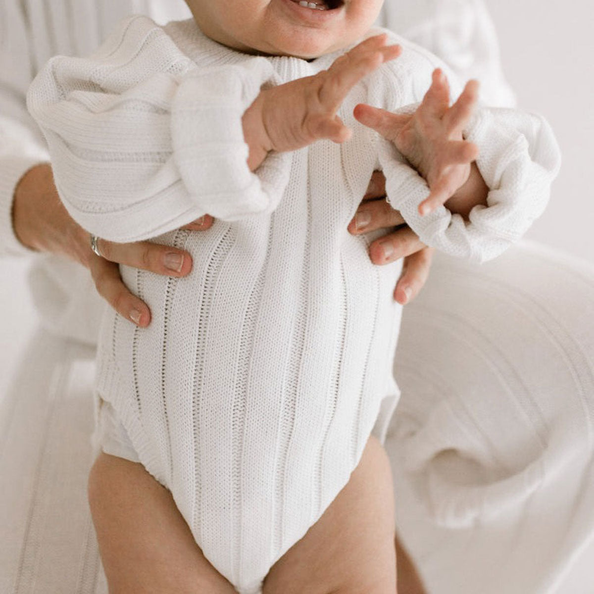 Baby wearing Oat and Co Wide Ribbed Knit Onesie - Dove
