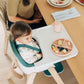 Baby eating food sitting in UPPAbaby CIRO High Chair - EMRICK (Spruce Green)
