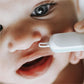 Parent uses Frida 3-in-1 Nose, Nail, and Ear Picker on baby's nose