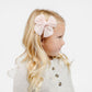 Little girl wearing Lou Lou and Company Cloud Muslin Heirloom Bow Clip - Blush