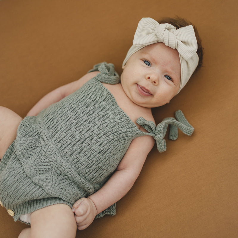 baby wearing Mebie Baby Ruffle Knit Bubble Romper - Sage 