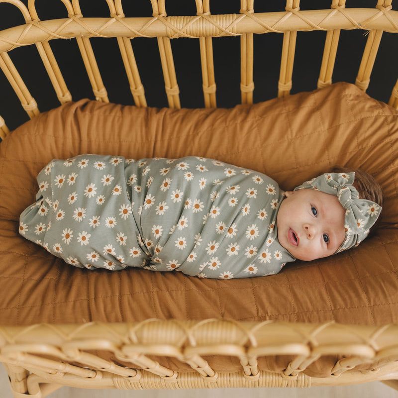 Baby wrapped in Mebie Baby Bamboo Stretch Swaddle Blanket - Light Green Daisy