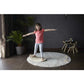 Little girl riding PlanToys Balance Board