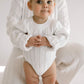 Baby wearing Oat and Co Wide Ribbed Knit Onesie - Dove