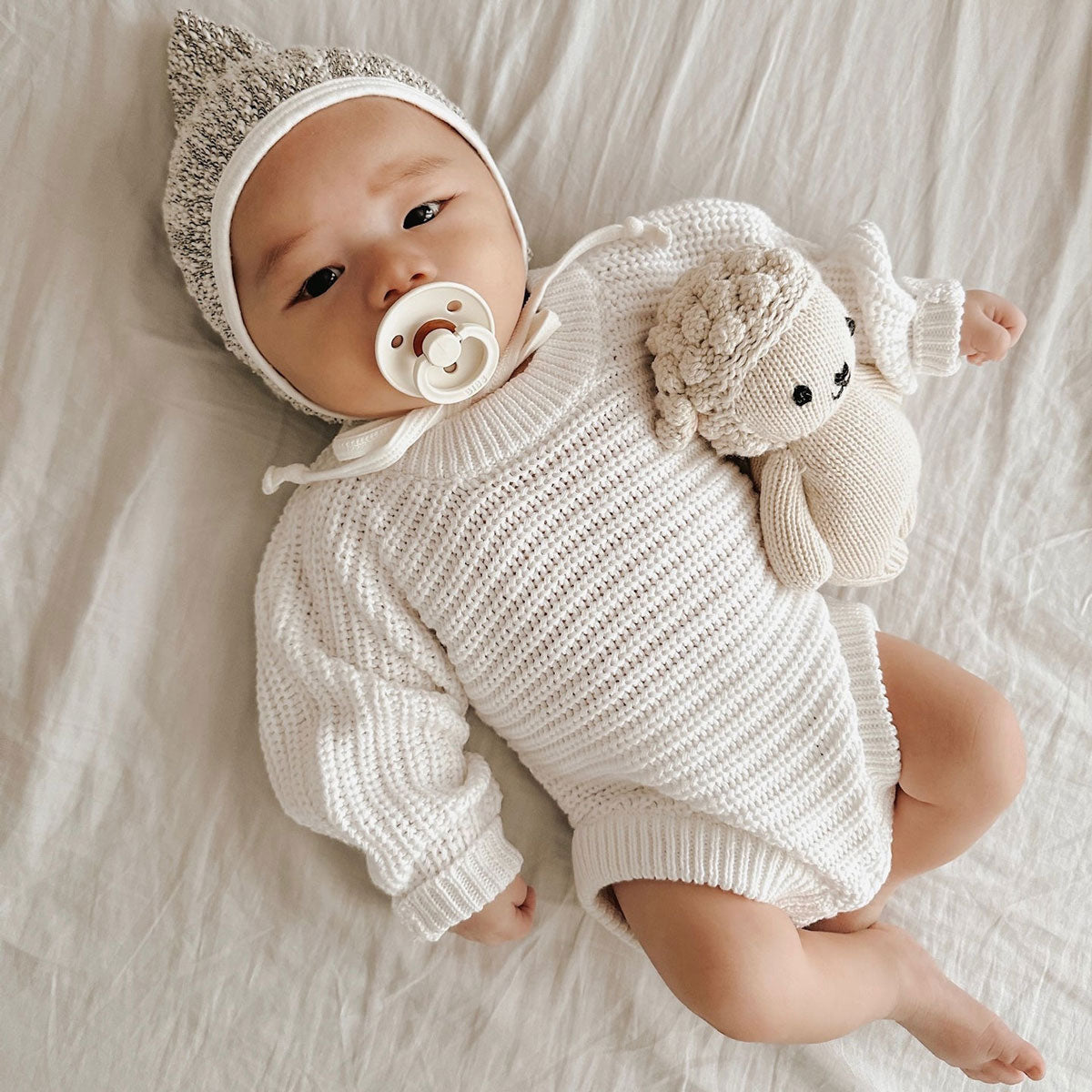 Baby wearing Oat and Co Chunky Knit Onesie - Dove