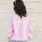 Woman wearing The Baby Cubby Crewneck Sweatshirt - Cubby Mama - Light Pink