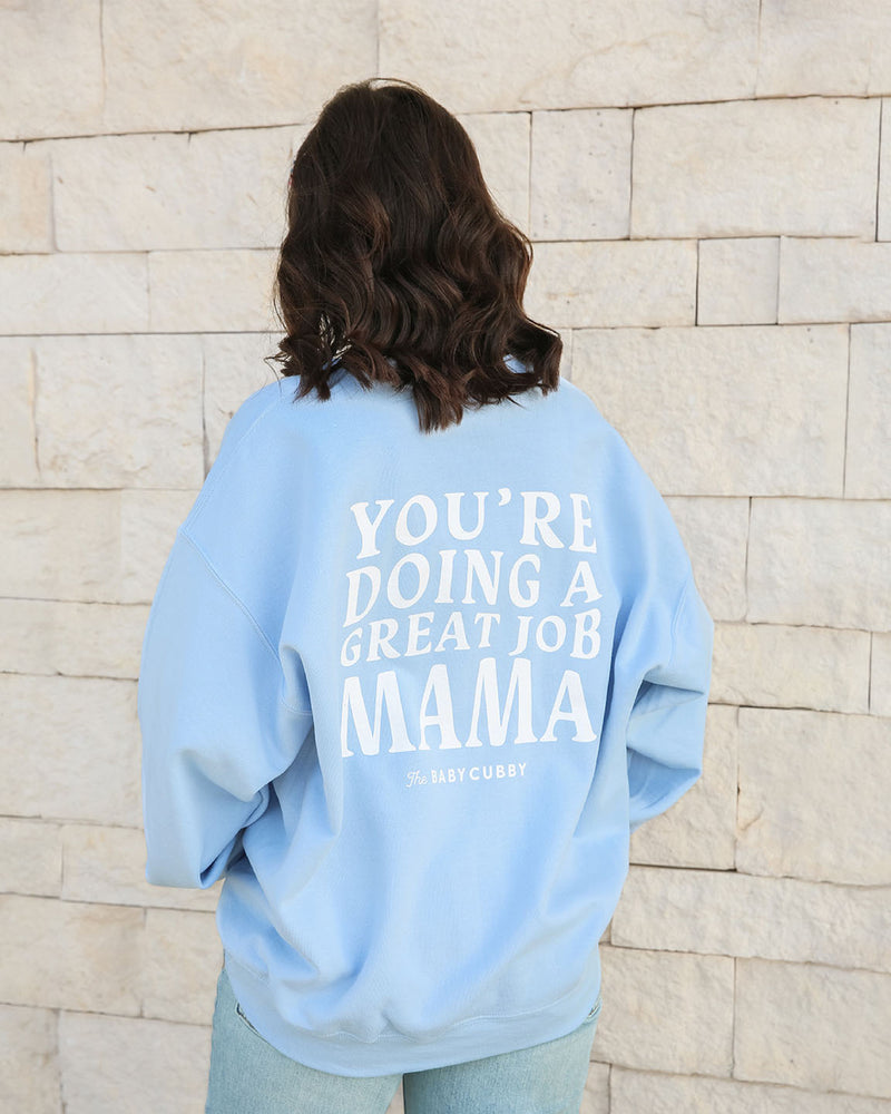 Woman wearing The Baby Cubby Crewneck Sweatshirt - You're Doing A Great Job Mama - Light Blue