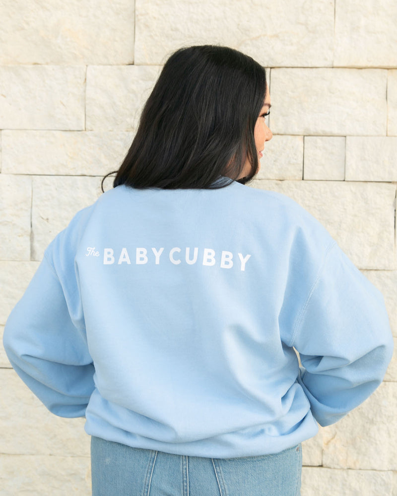 Woman wearing The Baby Cubby Crewneck Sweatshirt - Cubby Mama - Light Blue 