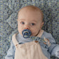 Baby with pacifier on BIBS LIBERTY Pacifier Clip - Chamomile Lawn Baby Blue