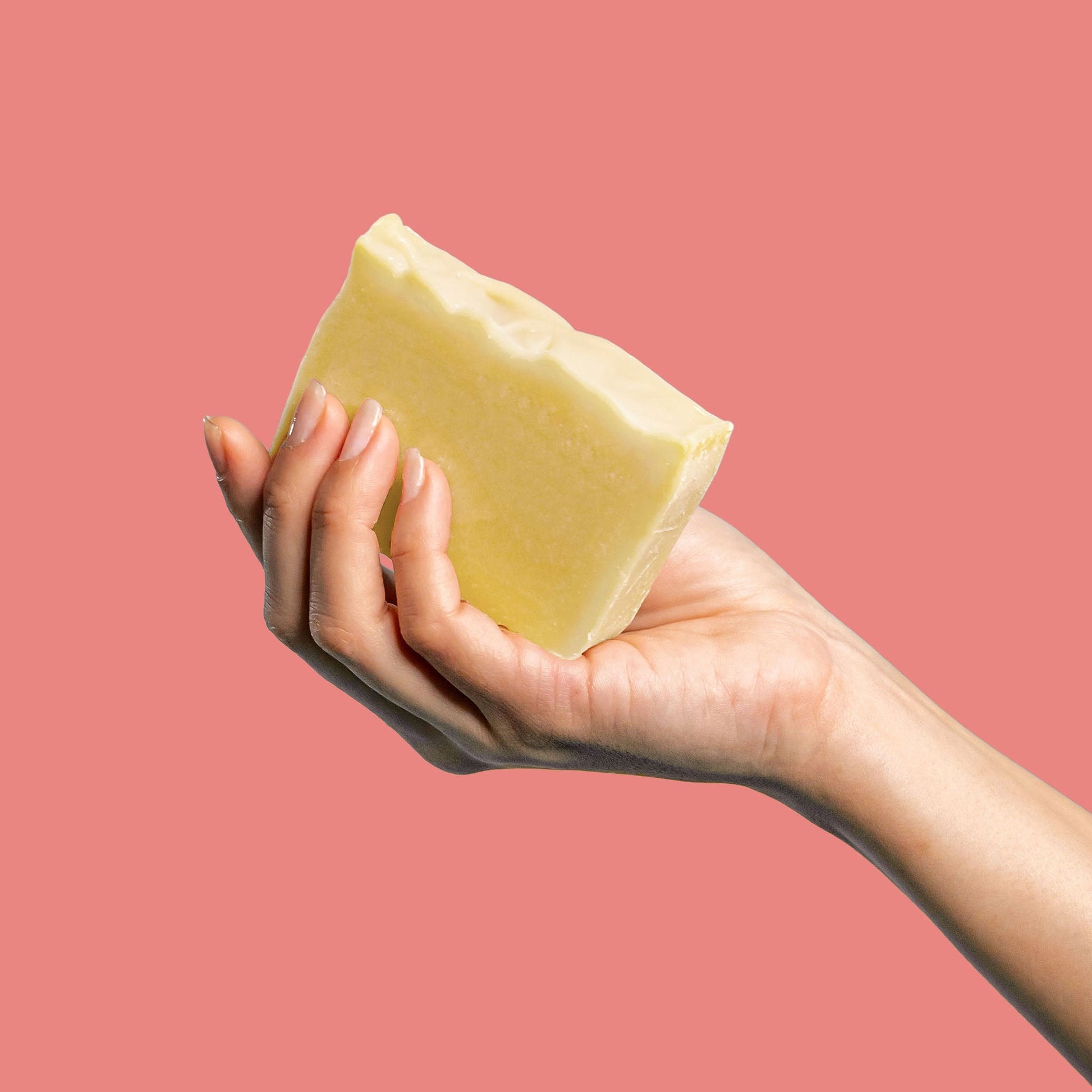 Woman holding Wink Well Foaming Oil Hydrating Bar Soap - Citrus Lavender