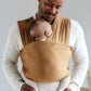 Man wearing baby in Solly Baby Wrap - Camel