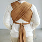 Man wearing baby in Solly Baby Wrap - Camel
