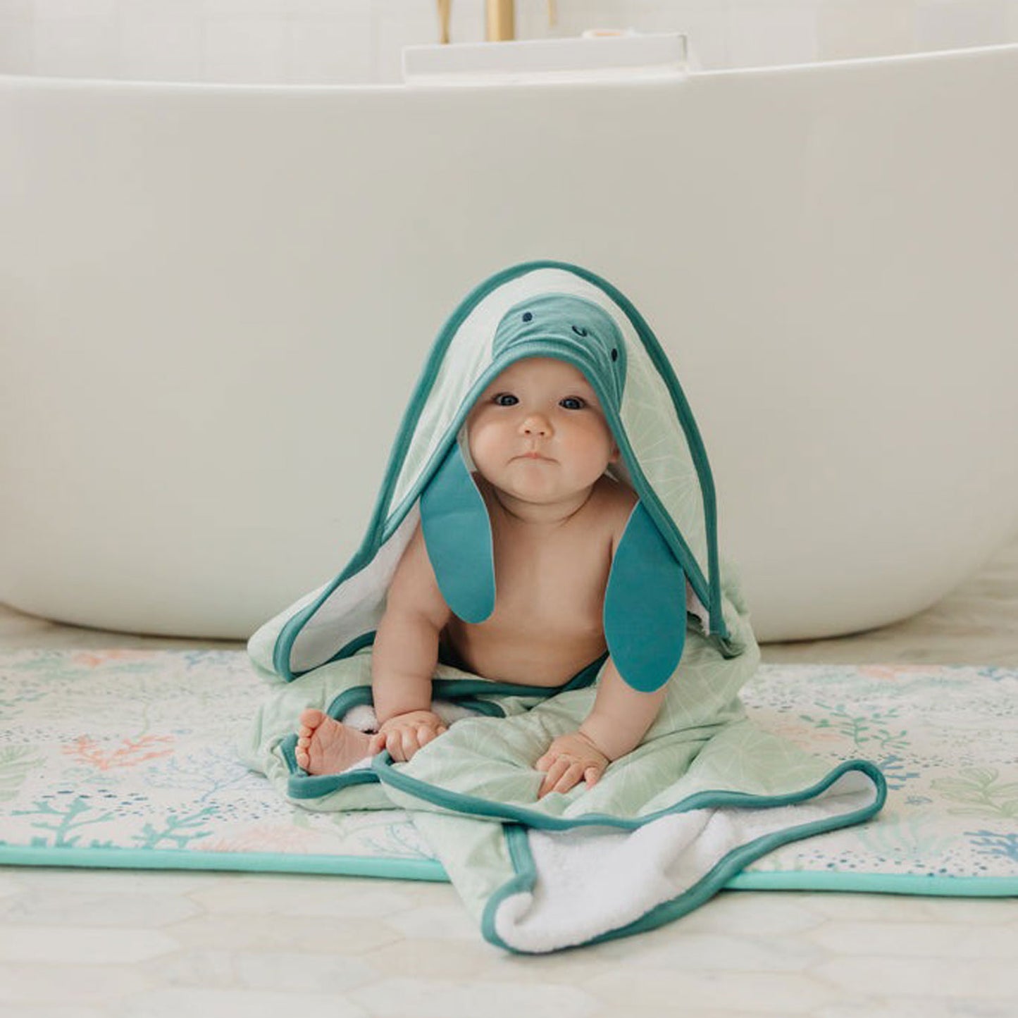 Baby wearing Copper Pearl Character Hooded Towel - Wade