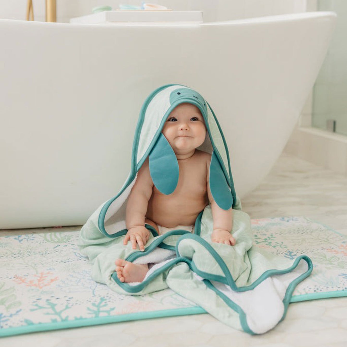 Baby wearing Copper Pearl Character Hooded Towel - Wade