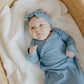 Baby girl wearing Copper Pearl Rib Knit Newborn Knotted Gown - Atlantic