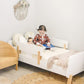 child sits on Dadada Muse Toddler Bed
