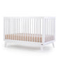 Baby sleeping in Dadada Soho 3-in-1 Convertible Crib - White