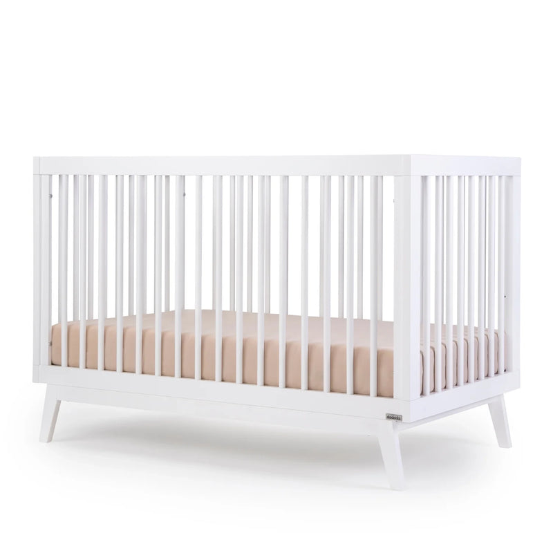 Baby sleeping in Dadada Soho 3-in-1 Convertible Crib - White