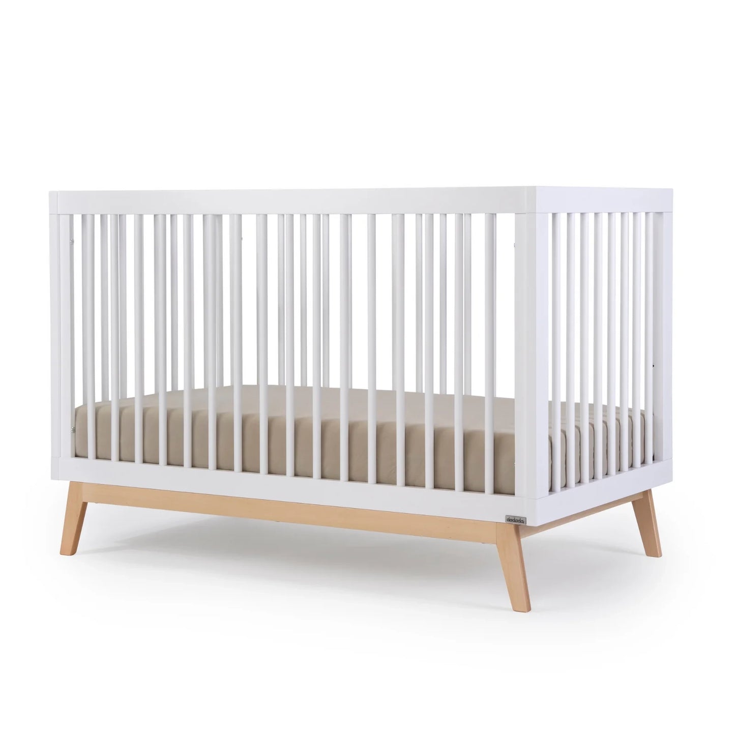 Baby sleeping in Dadada Soho 3-in-1 Convertible Crib - White / Natural
