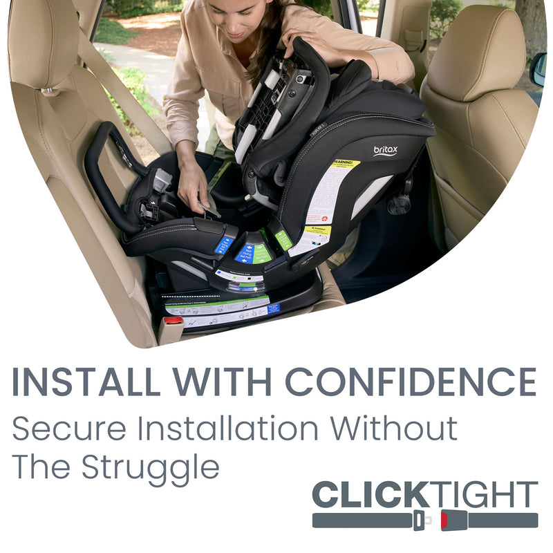 Mom installing Britax Poplar S ClickTight Convertible Car Seat - Onyx