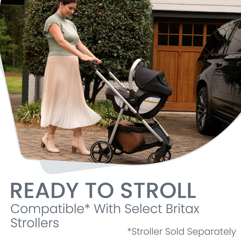 Mom pushing stroller while baby rides in Britax Willow SC Infant Car Seat - Pindot Onyx