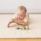 Baby plays with Itzy Ritzy Ritzy Rainbow Stacking Toy