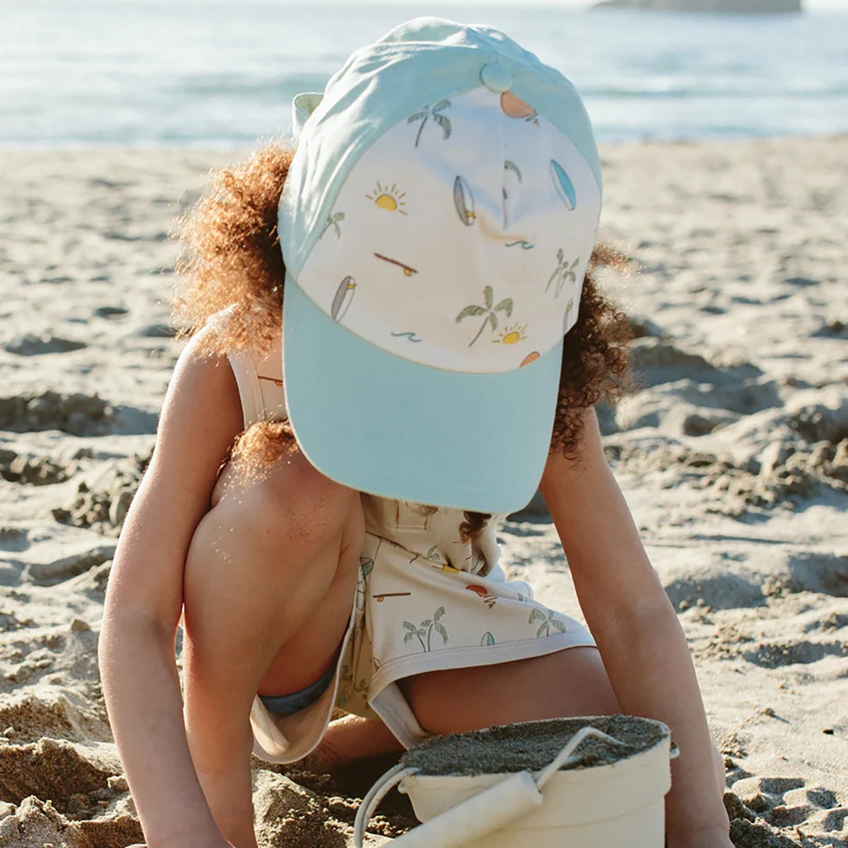 Child at Beach wearing goumikids Kids' Ball Cap - Surf's Up
