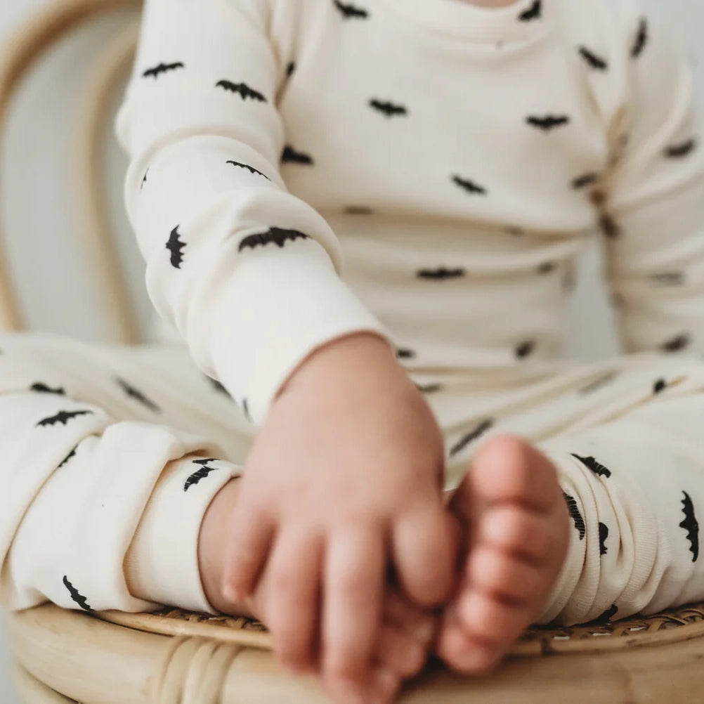 child wearing Lovedbaby Organic Kids' Long-Sleeve PJ Set - Bats 