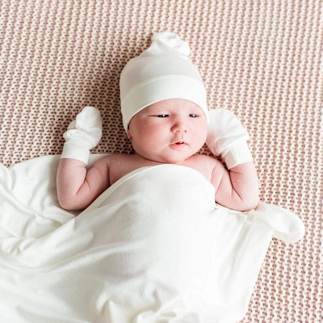 Baby wearing Kyte BABY Scratch Mitten - Infant - Cloud
