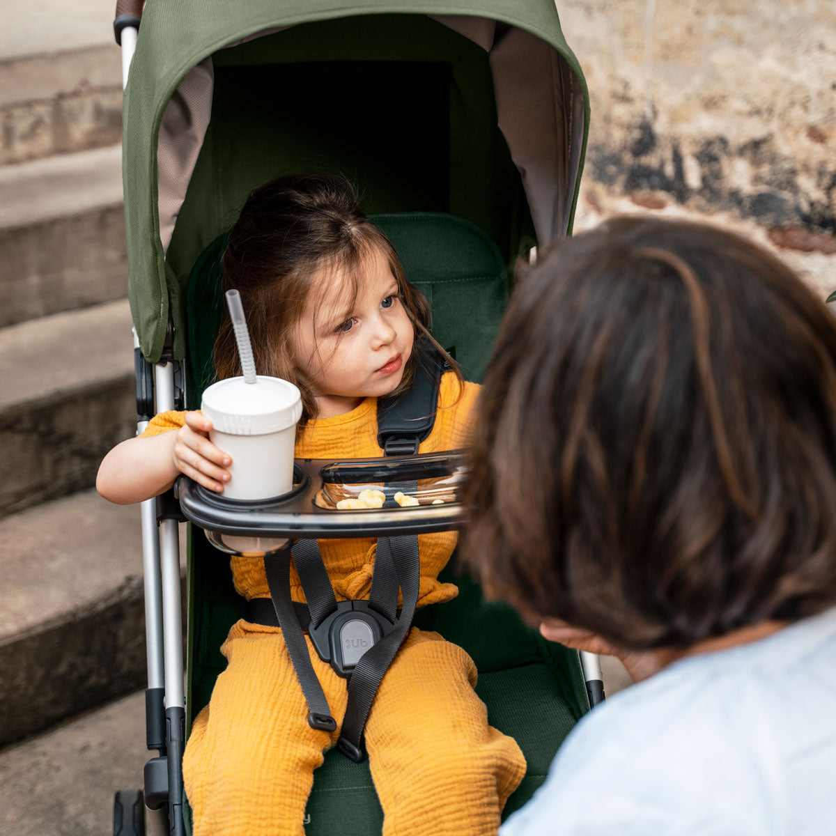 child in stroller with UPPAbaby MINU / MINU V2 Snack Tray