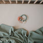 Mushie Teething Ring - Dino in a crib