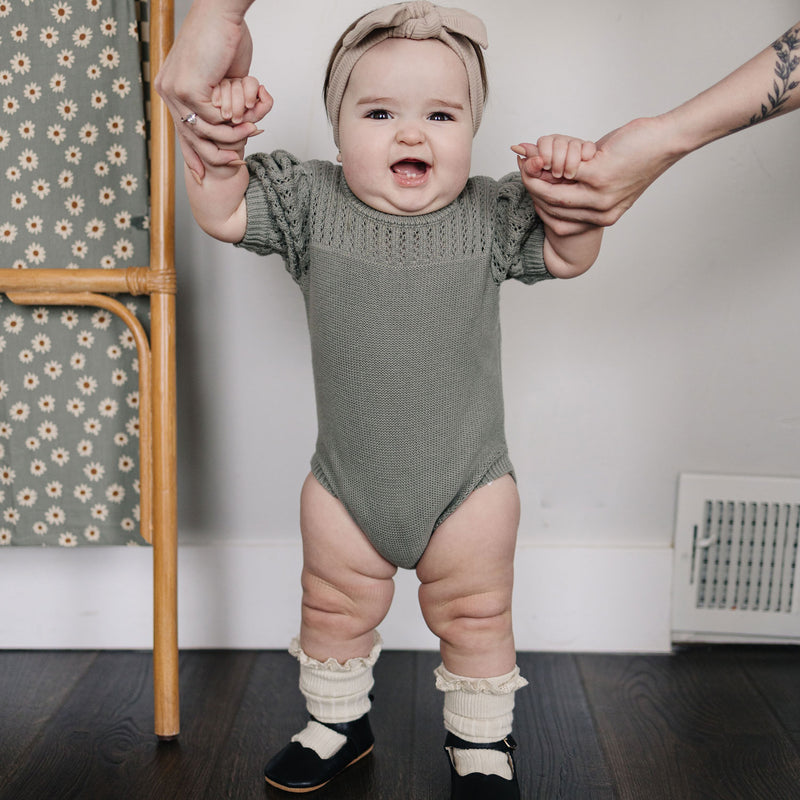 Baby wearing Mebie Baby Knit Shirt Romper - Sage