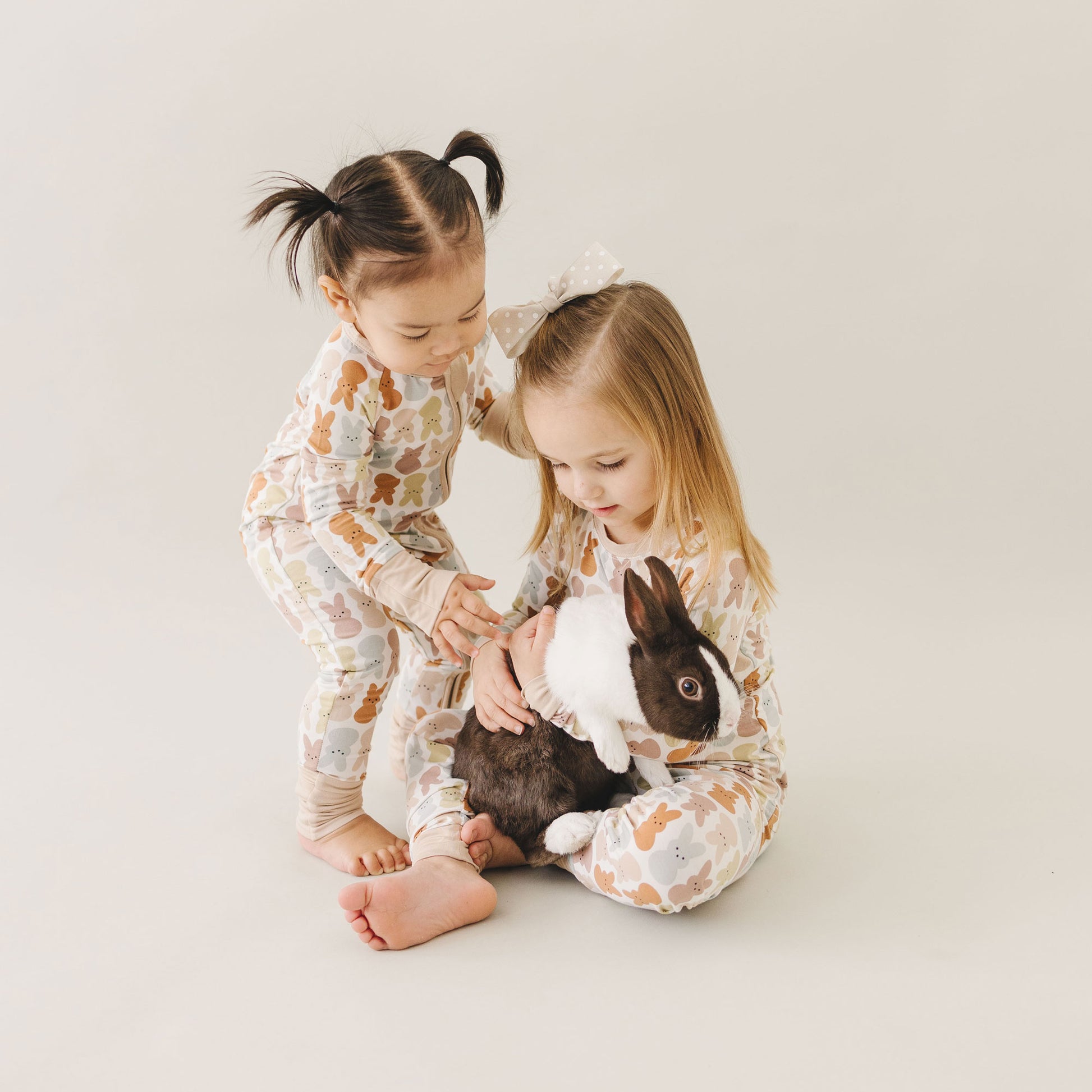 little girls wearing Mebie Baby Bamboo Zipper Pajama - Blush Bunny