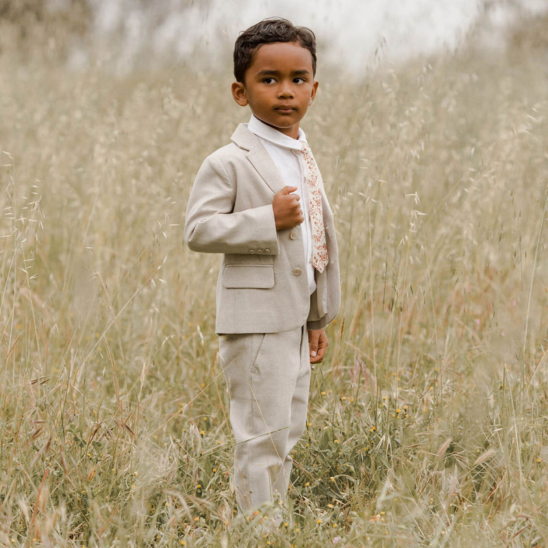 Boy standing in field wearing Noralee Skinny Tie - Vines - Berry / Natural