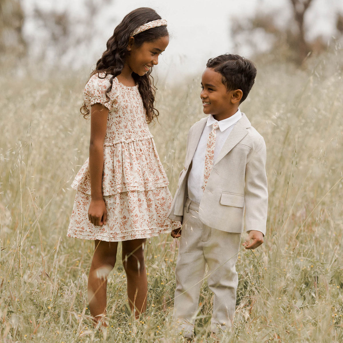 Boy standing next to girl while wearing Noralee Skinny Tie - Vines - Berry / Natural