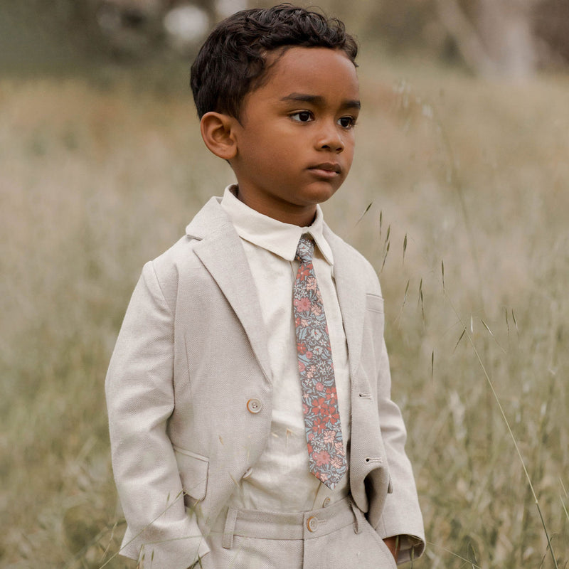 Boy standing in field wearing Noralee Skinny Tie - Berry Garden