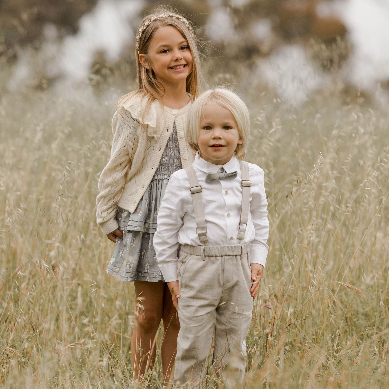 Little boy wearing Noralee Bow Tie - Chambray stands next to girl
