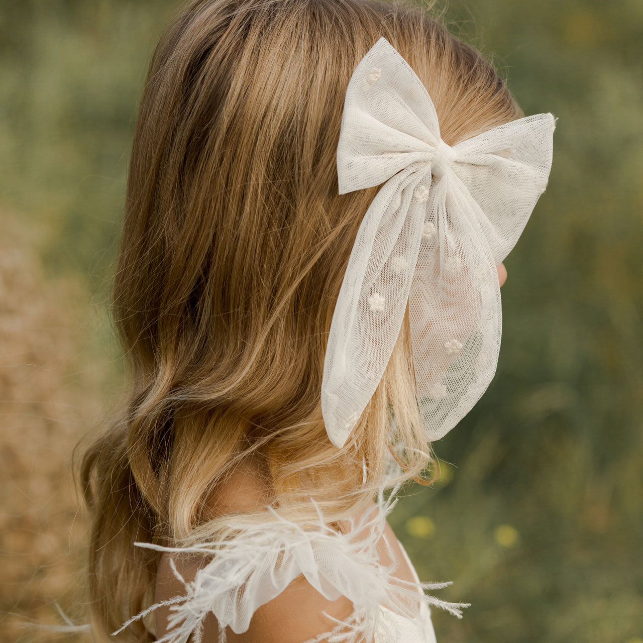 Little girl wearing Noralee Oversized Bow - Ivory Floral Tulle