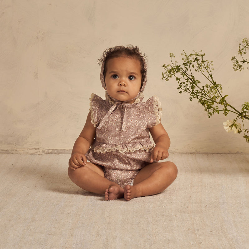 baby wearing Noralee Alice Romper - Lavender Bloom